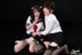 Tutor kneeling with student raising skirt exposing panties wearing black stockings